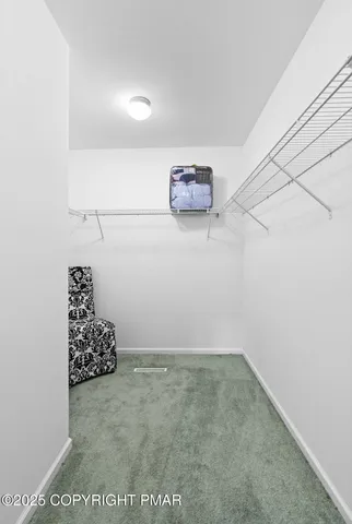 a view of a livingroom with furniture and a garage