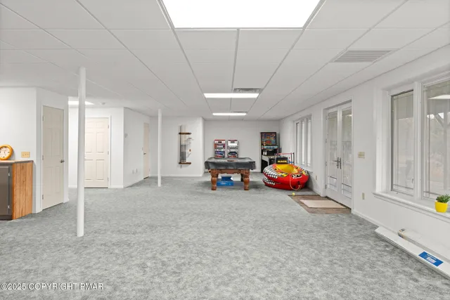 an aerial view of residential house with outdoor space and lake view