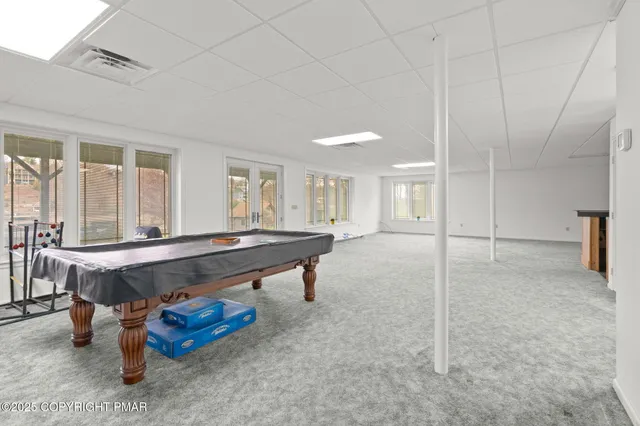 an aerial view of a house with a lake view