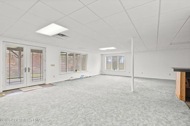 a view of a balcony with wooden floor and fence