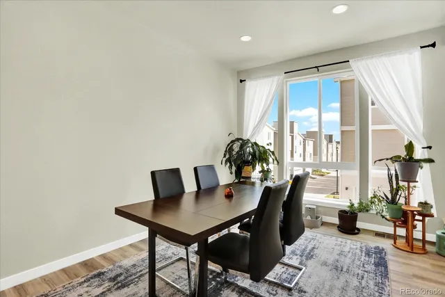 a view of a dining room with furniture and window