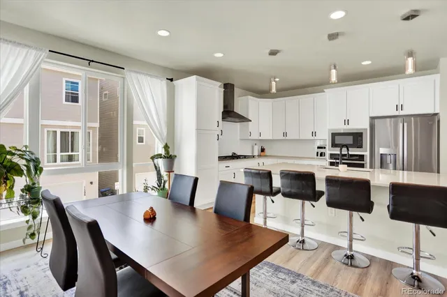 a view of kitchen with dining table and chairs