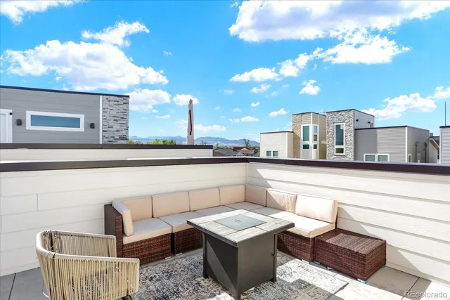a view of a patio with couches table and chairs