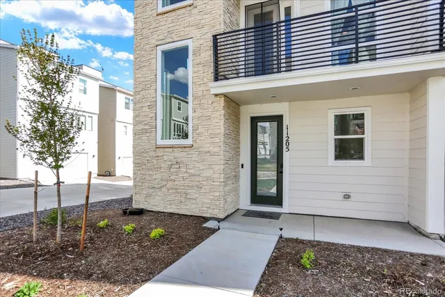 a view of a house with a door and a window