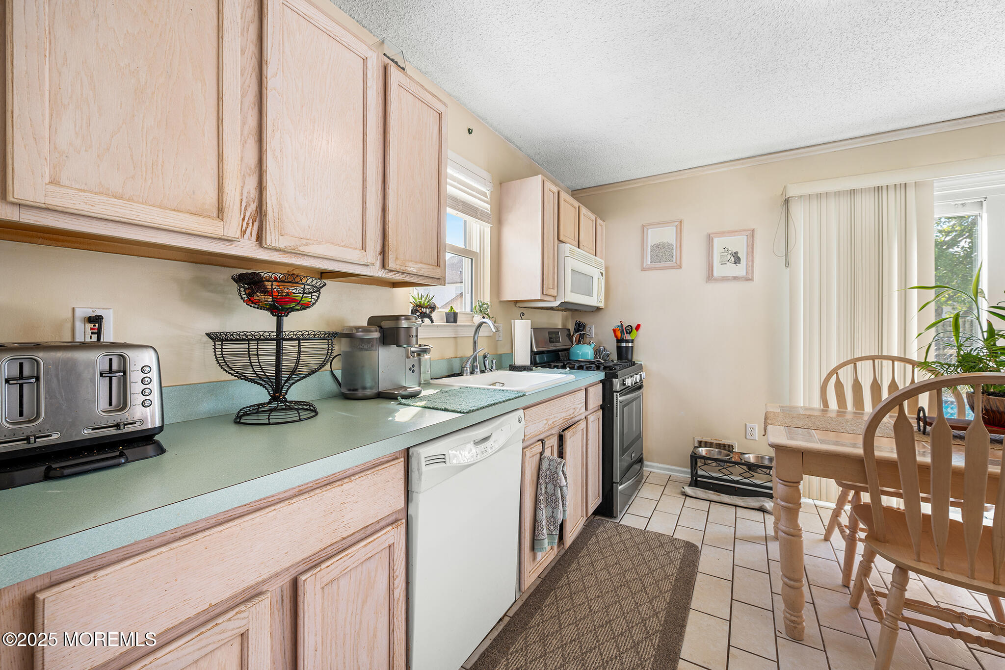 33 Bryce Canyon Road Howell, NJ 07731 - Photo 12 of 44 a kitchen with stainless steel appliances granite countertop a sink and cabinets