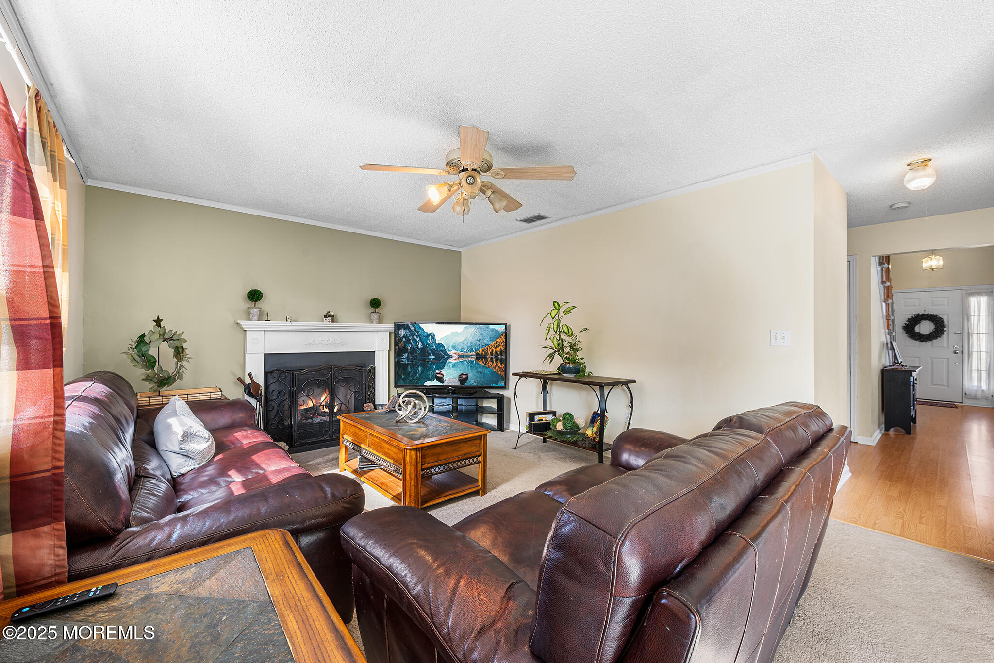33 Bryce Canyon Road Howell, NJ 07731 - Photo 16 of 44 a living room with furniture and a fireplace