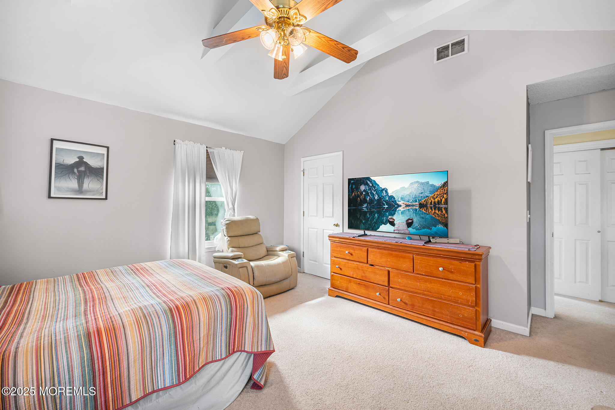 33 Bryce Canyon Road Howell, NJ 07731 - Photo 22 of 44 a bedroom with a bed and a chandelier