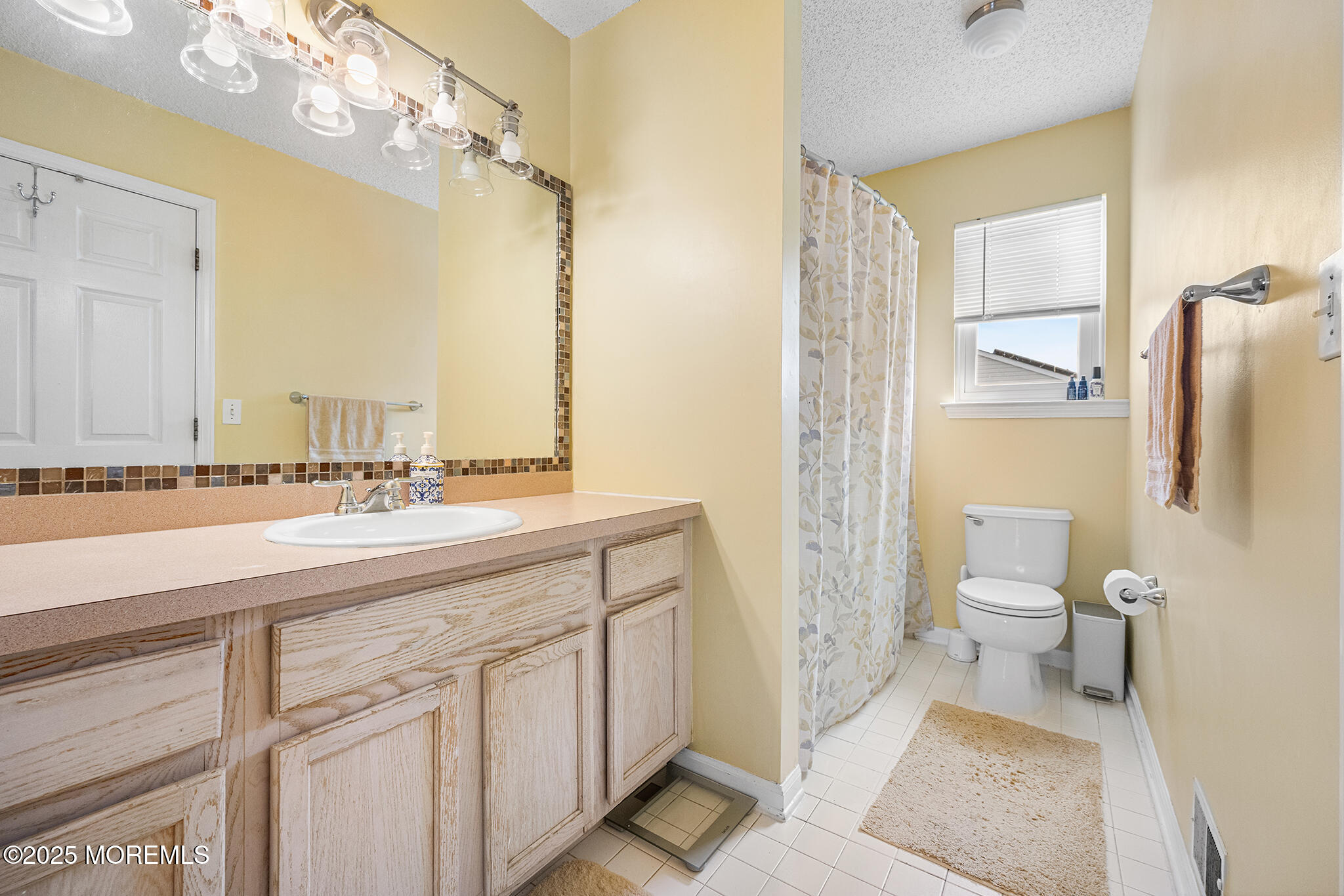 33 Bryce Canyon Road Howell, NJ 07731 - Photo 35 of 44 a bathroom with a sink a toilet and shower
