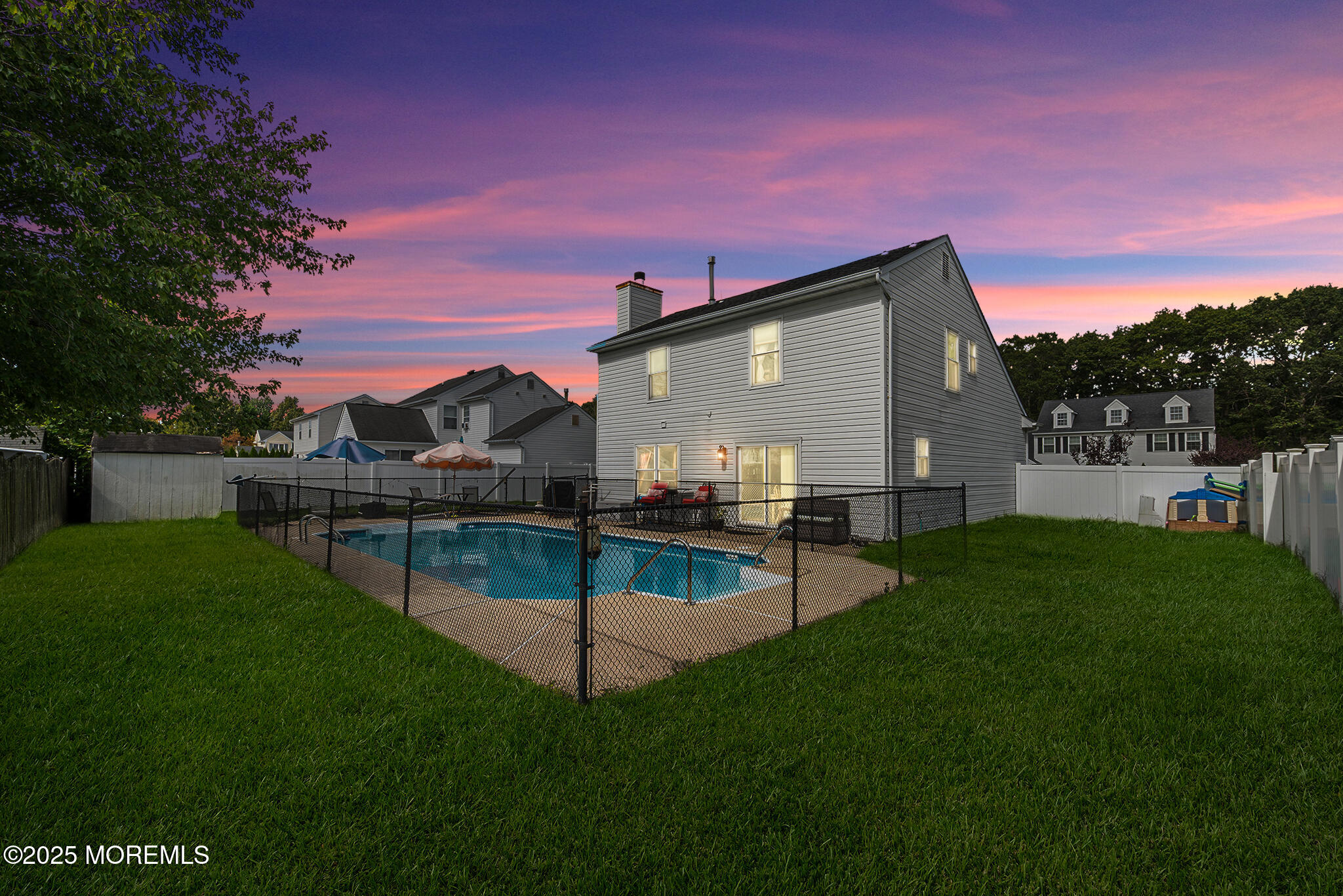 33 Bryce Canyon Road Howell, NJ 07731 - Photo 37 of 44 a backyard of a house with table and chairs