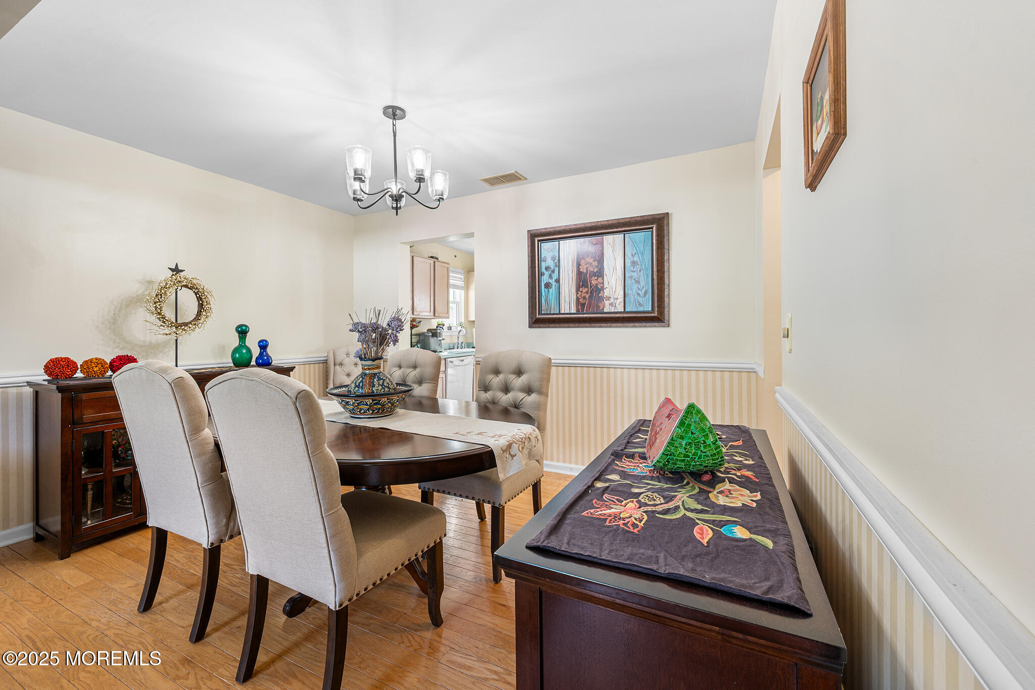 33 Bryce Canyon Road Howell, NJ 07731 - Photo 8 of 44 a view of a dining room with furniture and a chandelier