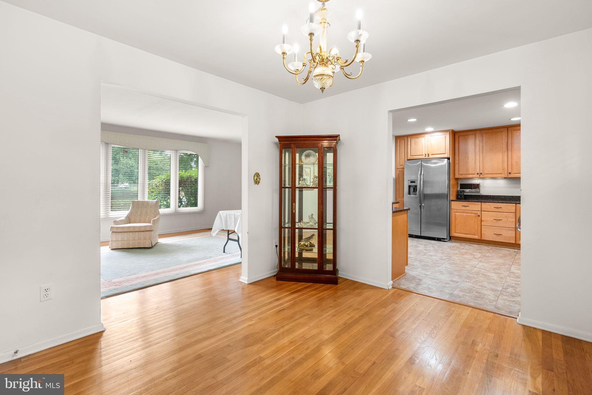 4004 Briars Road Olney, MD 20832 - Photo 11 of 46 a view of a livingroom with furniture wooden floor and windows