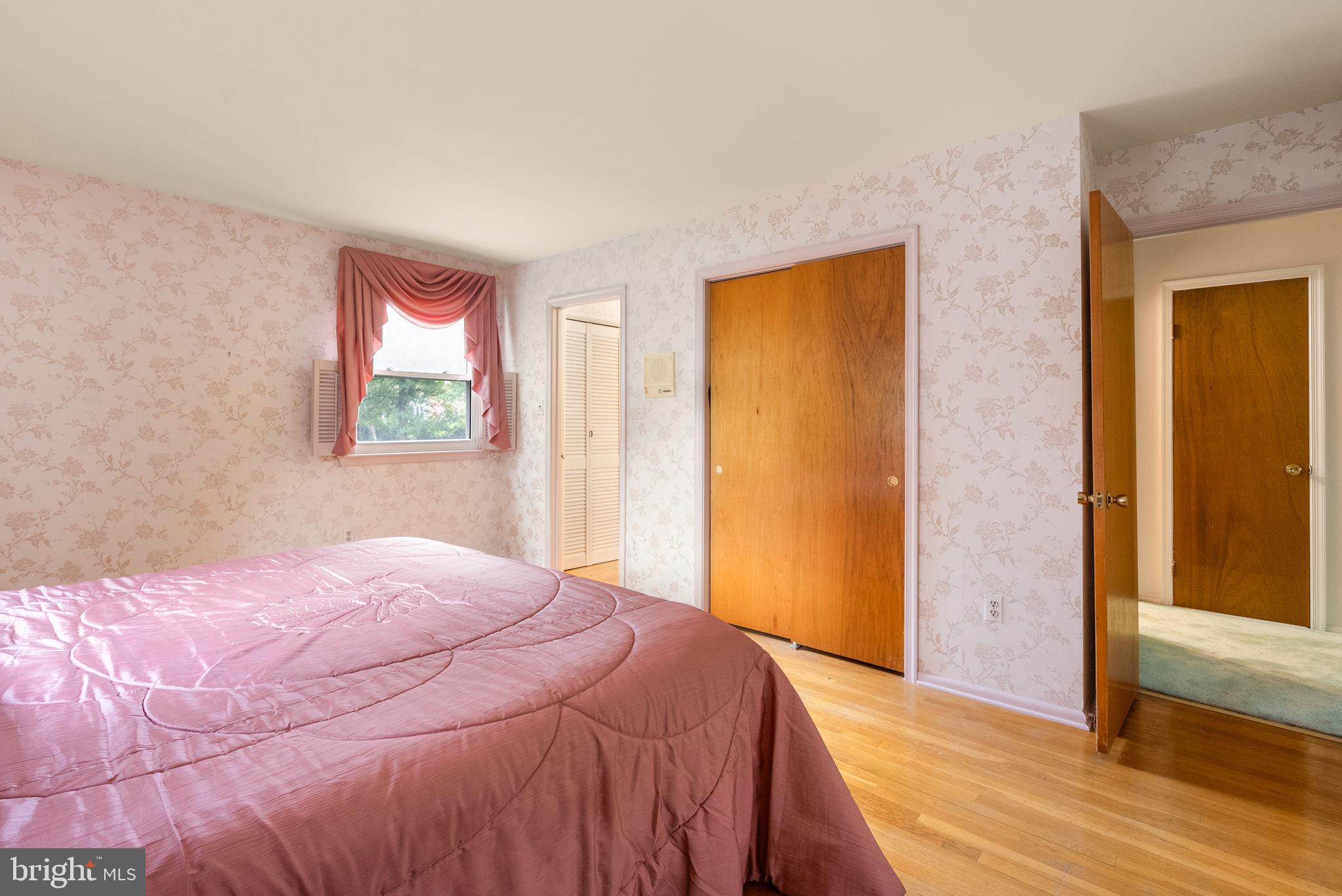 4004 Briars Road Olney, MD 20832 - Photo 24 of 46 a bedroom with a bed and a window