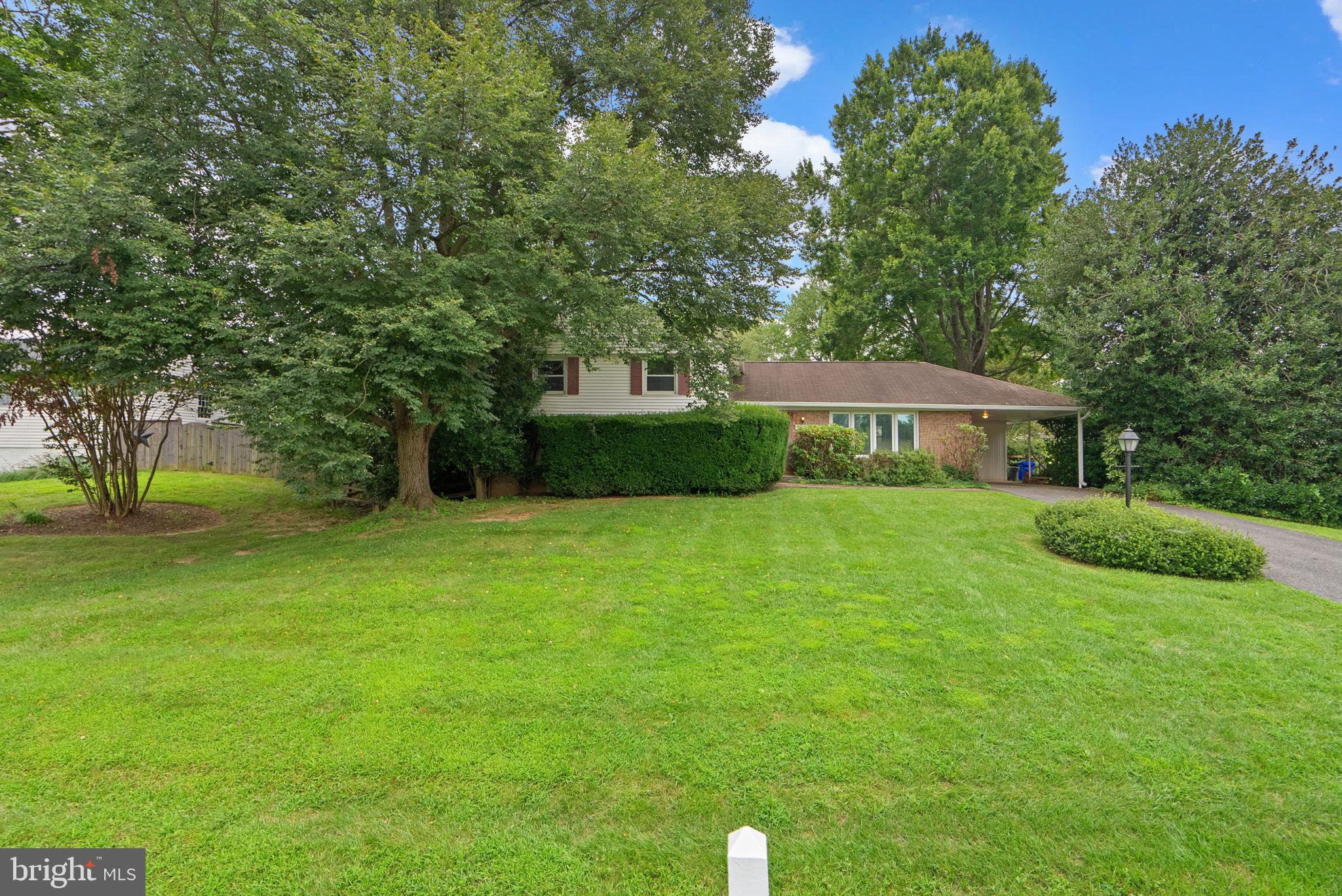 4004 Briars Road Olney, MD 20832 - Photo 3 of 46 a front view of a house with garden