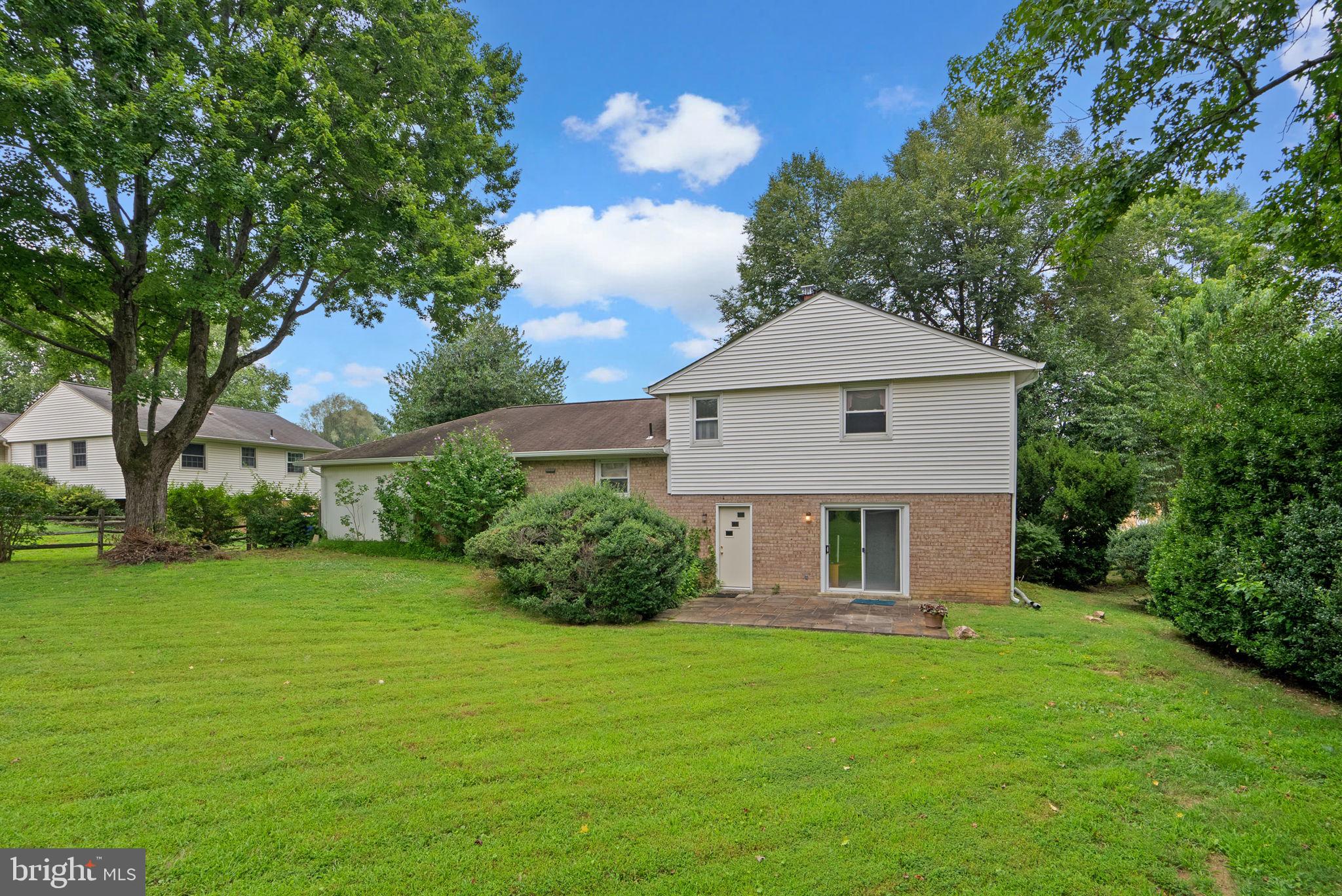 4004 Briars Road Olney, MD 20832 - Photo 42 of 46 a front view of a house with garden