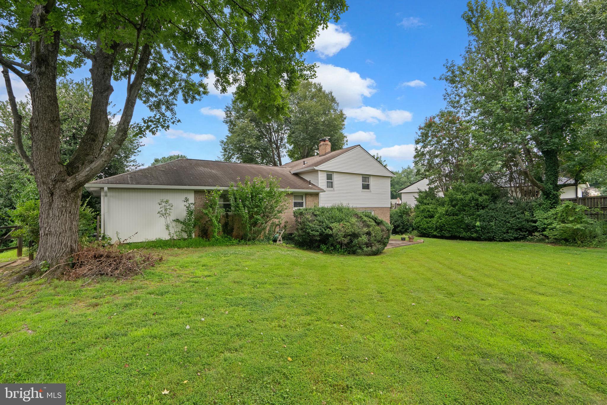4004 Briars Road Olney, MD 20832 - Photo 44 of 46 a view of a house with a yard