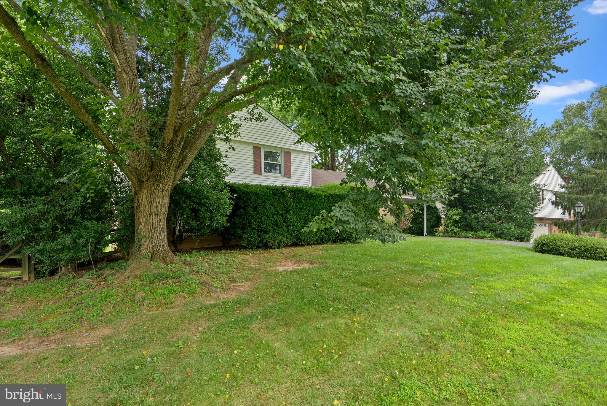 4004 Briars Road Olney, MD 20832 - Photo 5 of 46 a front view of a house with a yard