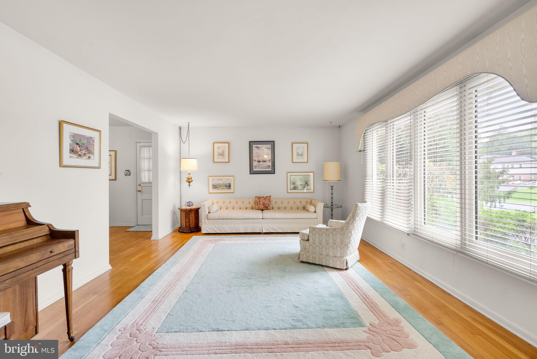 4004 Briars Road Olney, MD 20832 - Photo 7 of 46 a living room with furniture and a large window