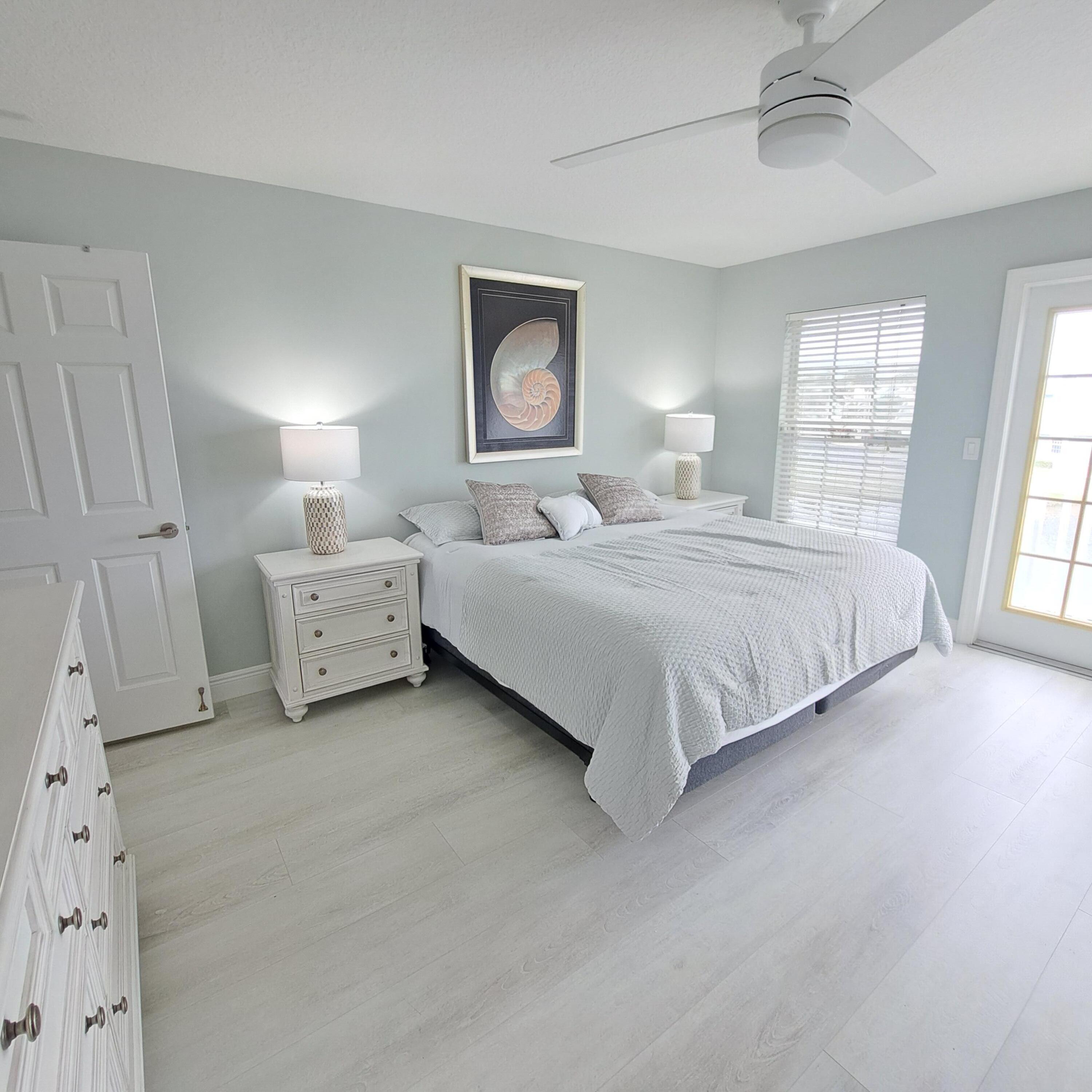 904 Ocean Dunes Circle Jupiter, FL 33477 - Photo 16 of 49 a bedroom with bed and a window