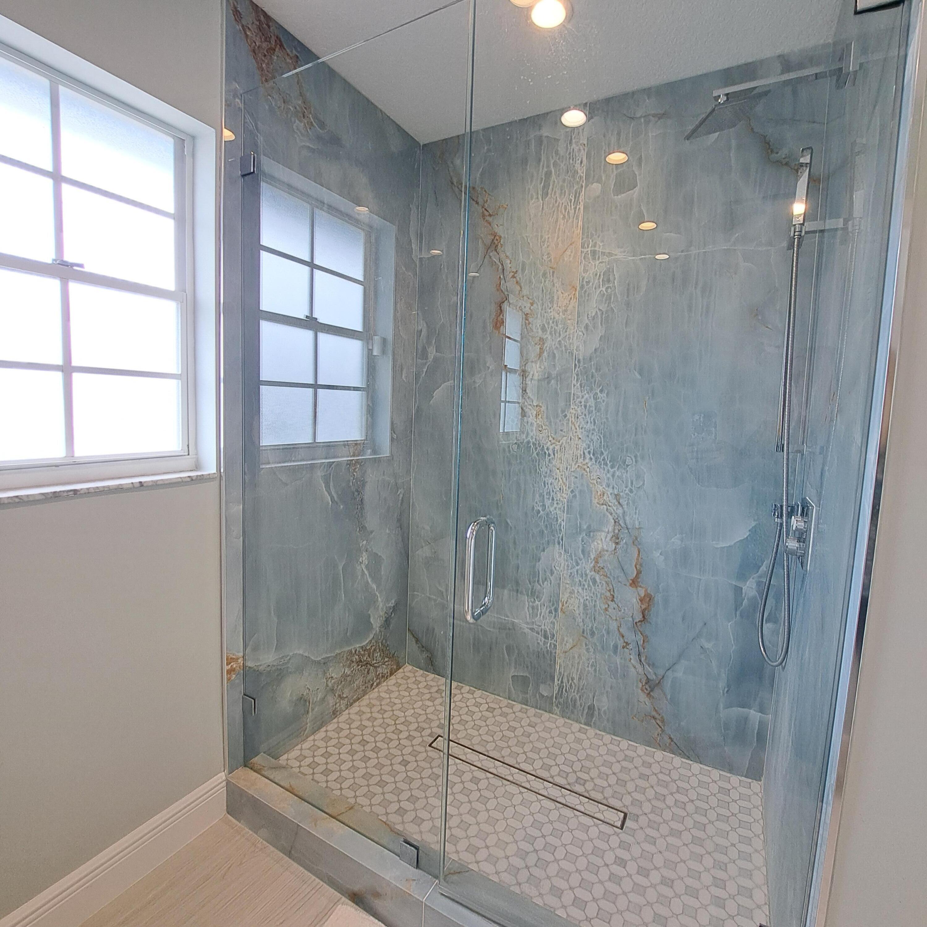 904 Ocean Dunes Circle Jupiter, FL 33477 - Photo 18 of 49 a bathroom with a shower