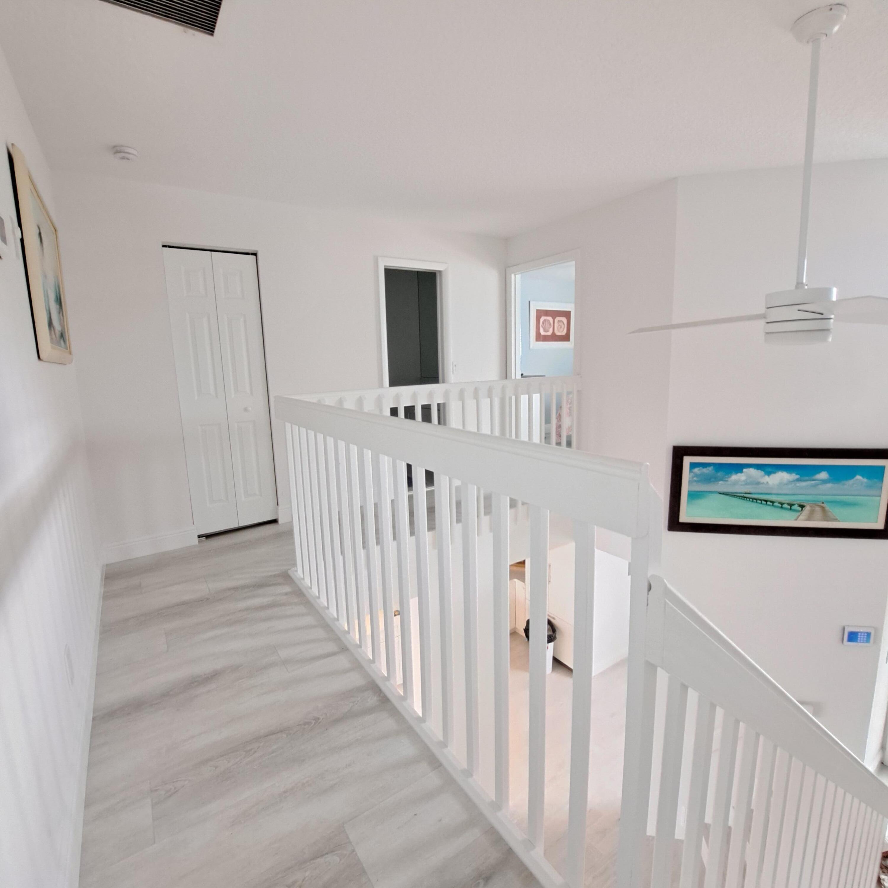 904 Ocean Dunes Circle Jupiter, FL 33477 - Photo 22 of 49 a view of a hallway with windows