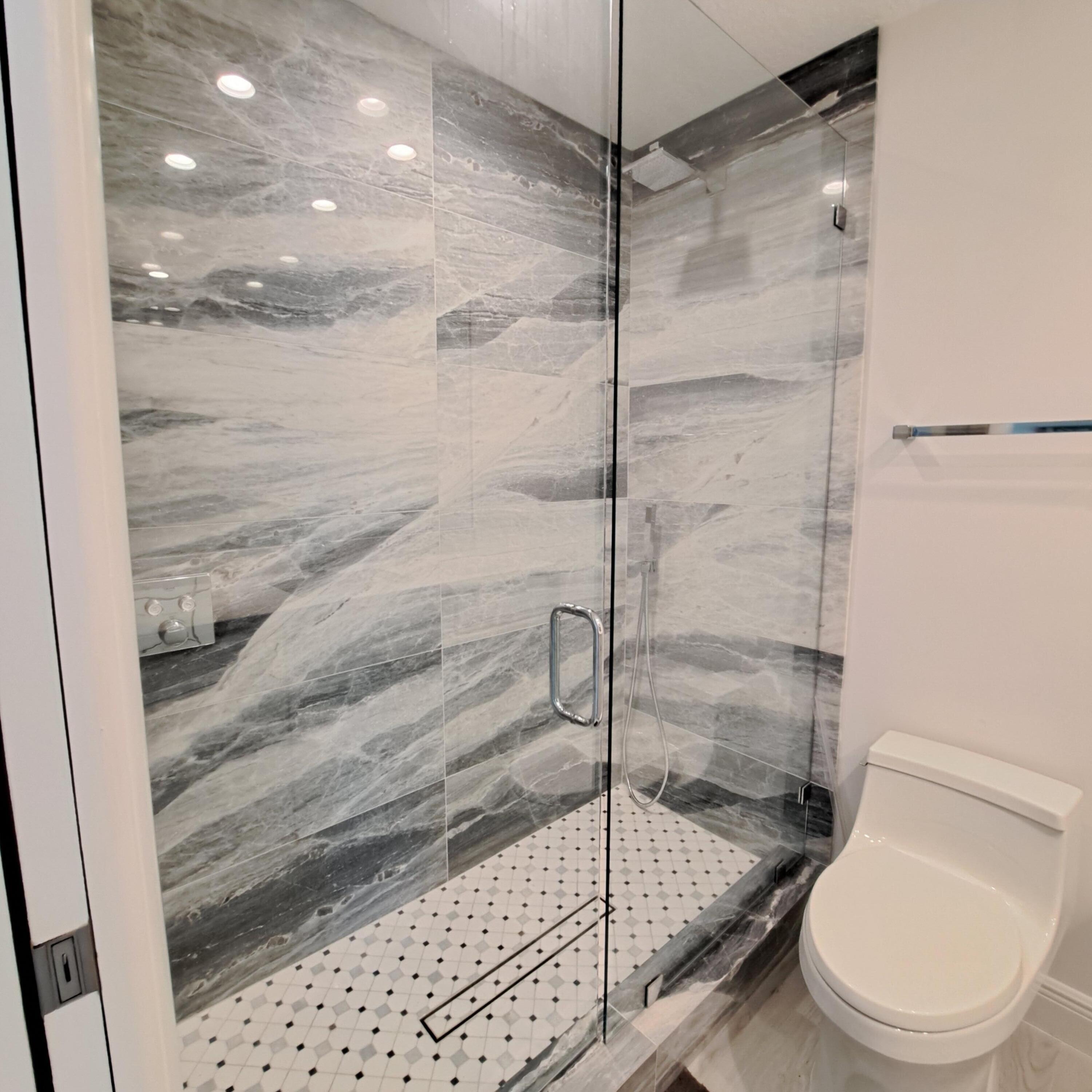 904 Ocean Dunes Circle Jupiter, FL 33477 - Photo 25 of 49 a bathroom with a shower and toilet