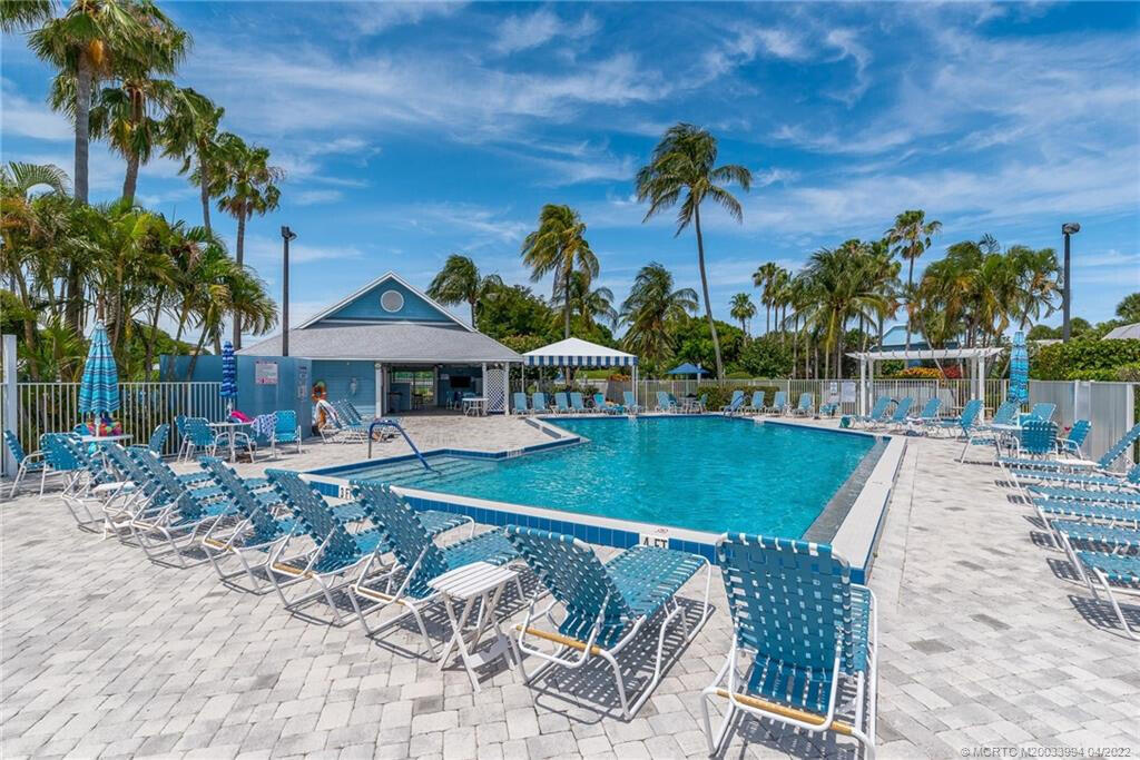904 Ocean Dunes Circle Jupiter, FL 33477 - Photo 29 of 49 a view of house with swimming pool outdoor seating