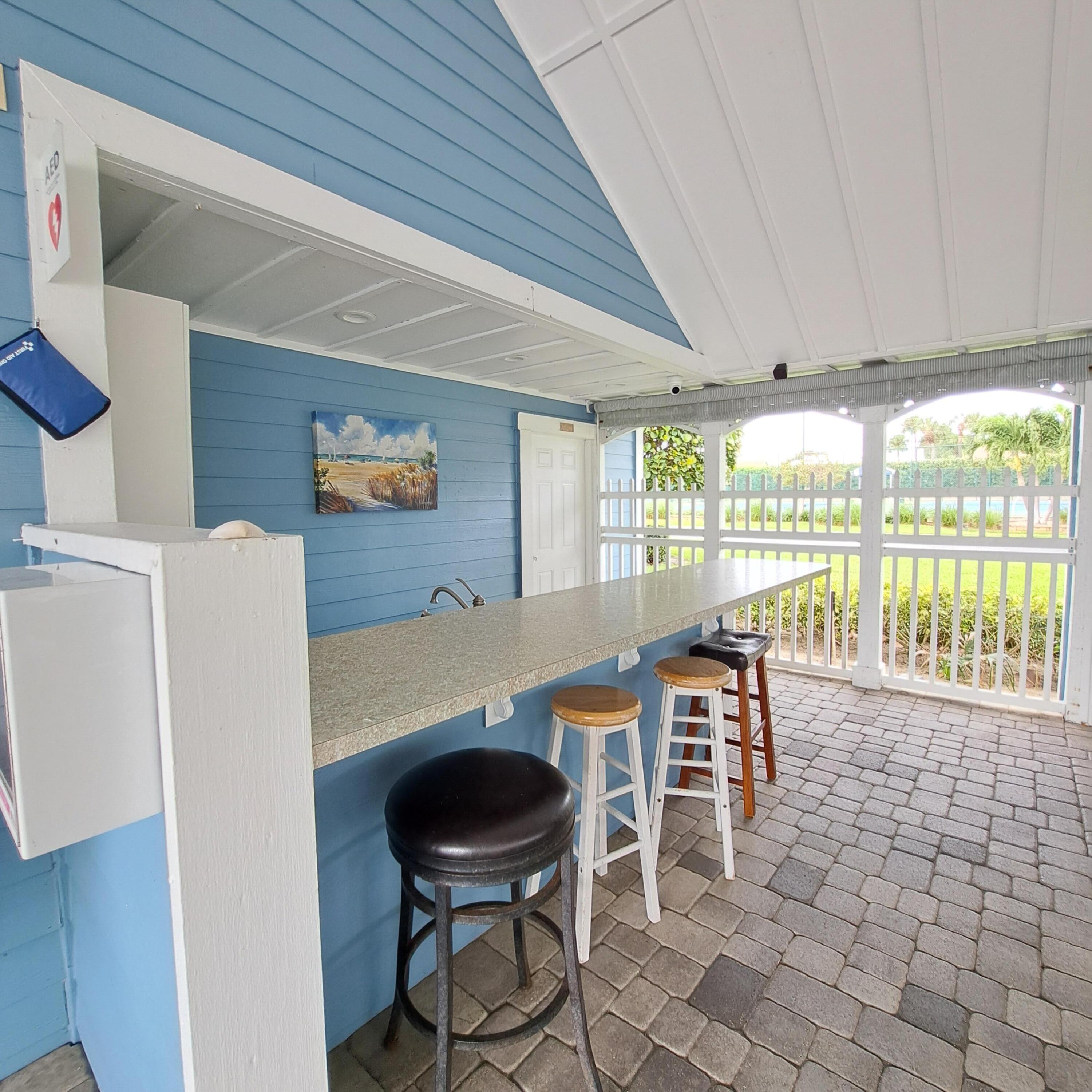 904 Ocean Dunes Circle Jupiter, FL 33477 - Photo 37 of 49 a dining room with furniture and large windows