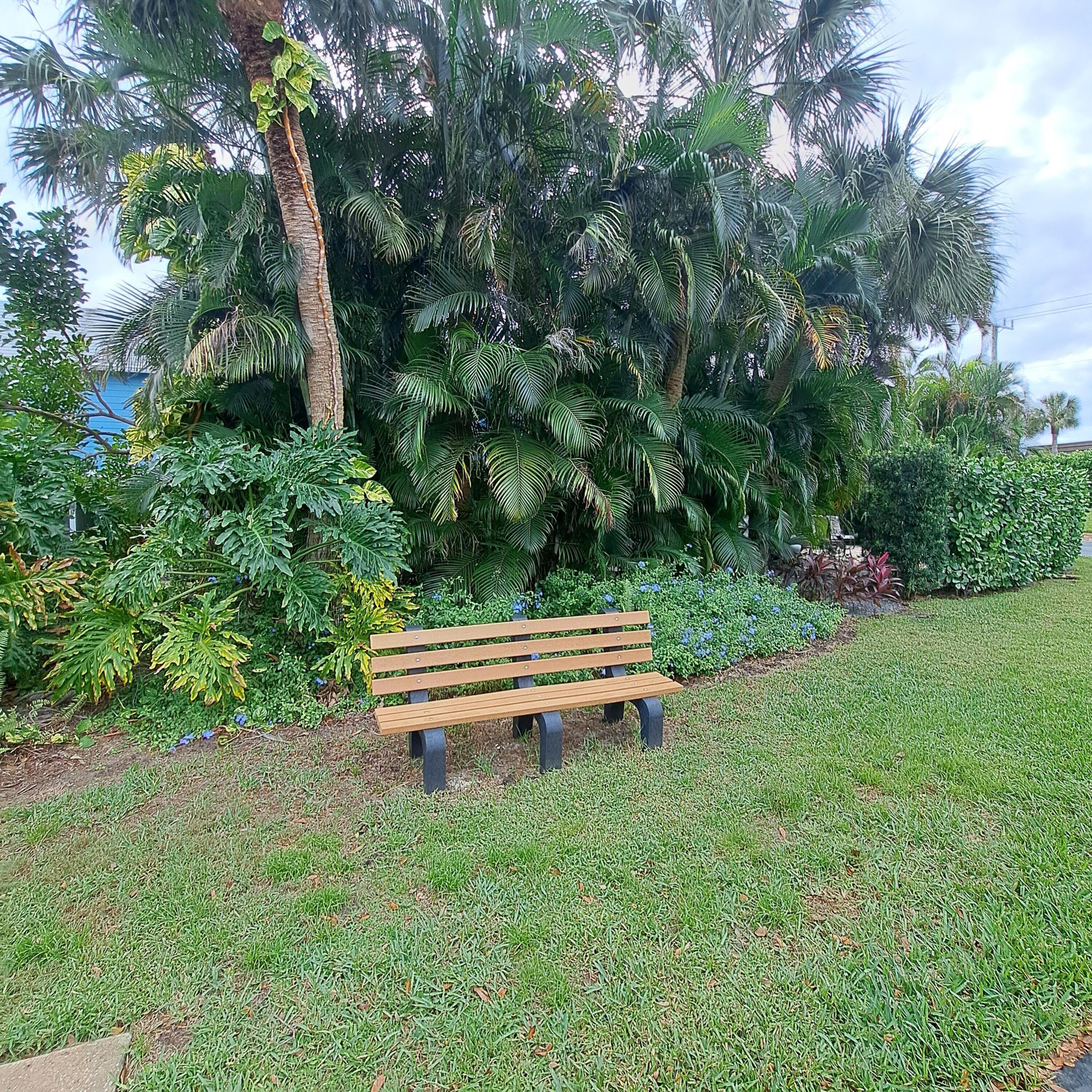 904 Ocean Dunes Circle Jupiter, FL 33477 - Photo 40 of 49 a view of a bench in a garden