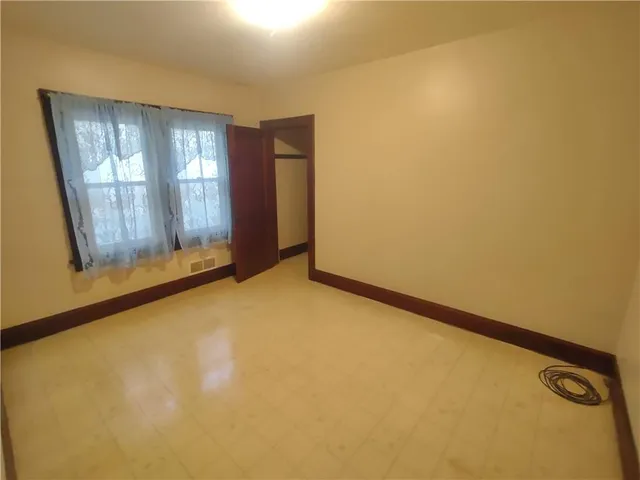 a view of an empty room and window