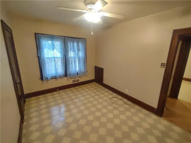 a view of an empty room and window