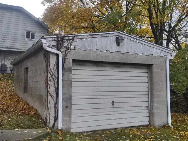 a front view of a house with garage