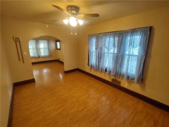 a view of an entryway with wooden floor
