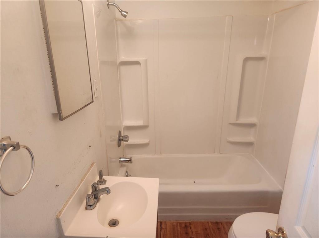 1726 Ridge Avenue Coraopolis, PA 15108 - Photo 12 of 41 a bathroom with a sink a toilet and bathtub