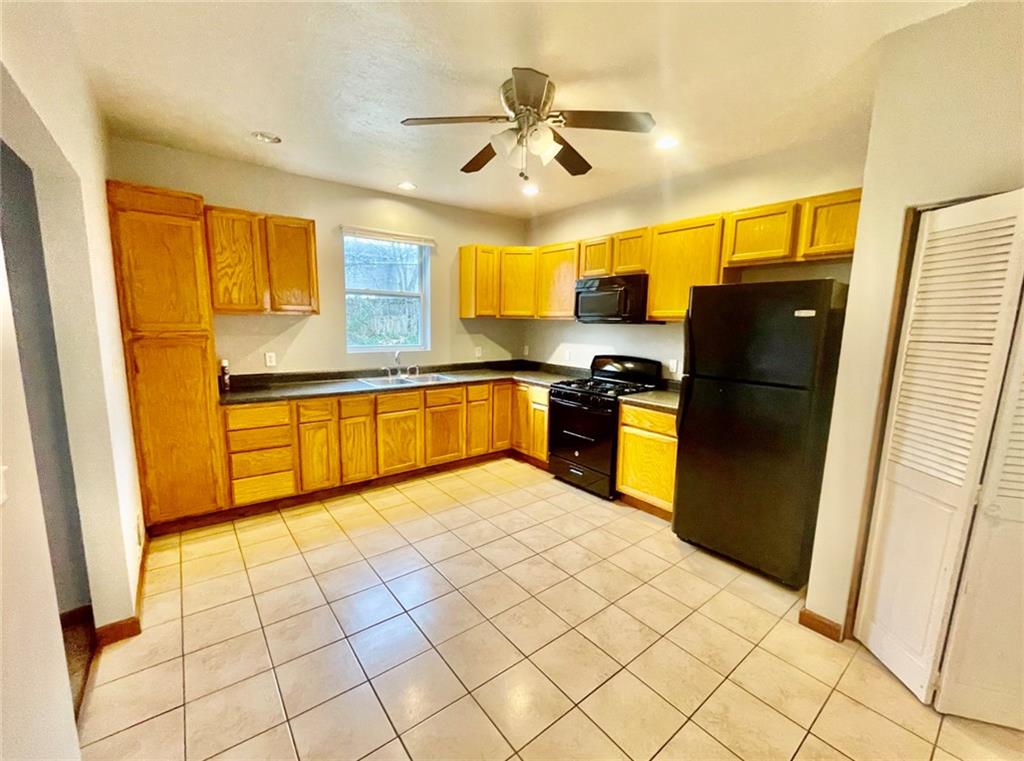 1726 Ridge Avenue Coraopolis, PA 15108 - Photo 17 of 41 a kitchen with stainless steel appliances granite countertop a refrigerator and a sink