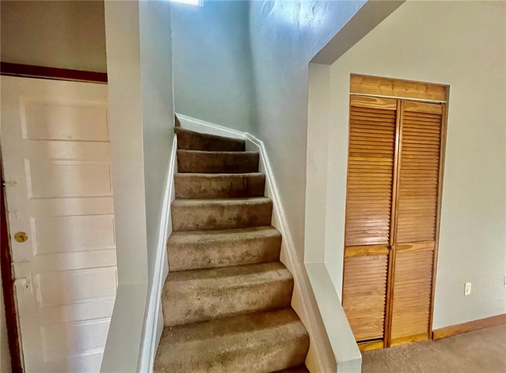 1726 Ridge Avenue Coraopolis, PA 15108 - Photo 20 of 41 a view of staircase with white walls and a window