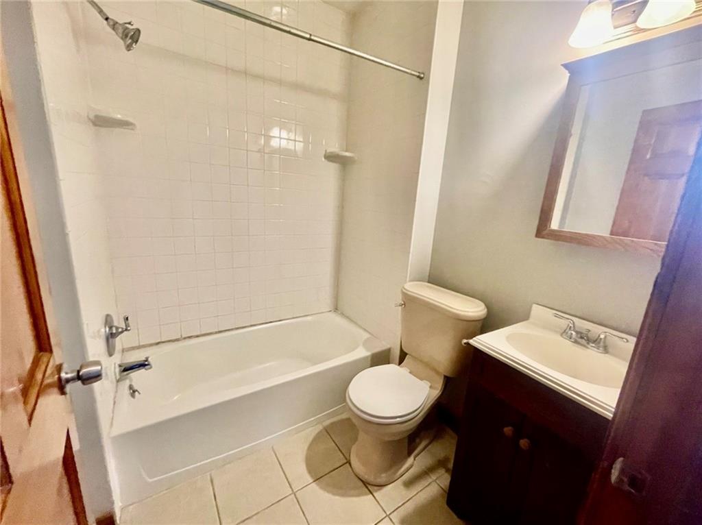 1726 Ridge Avenue Coraopolis, PA 15108 - Photo 28 of 41 a bathroom with a toilet a sink and bathtub