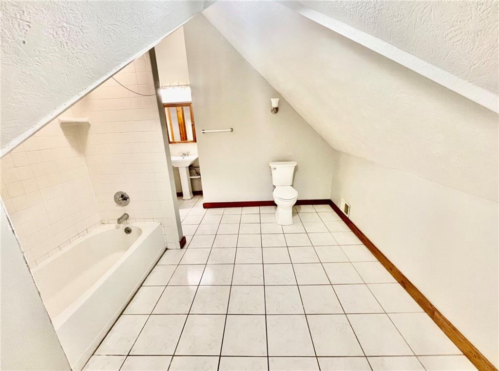 1726 Ridge Avenue Coraopolis, PA 15108 - Photo 29 of 41 a bathroom with a bathtub and a shower