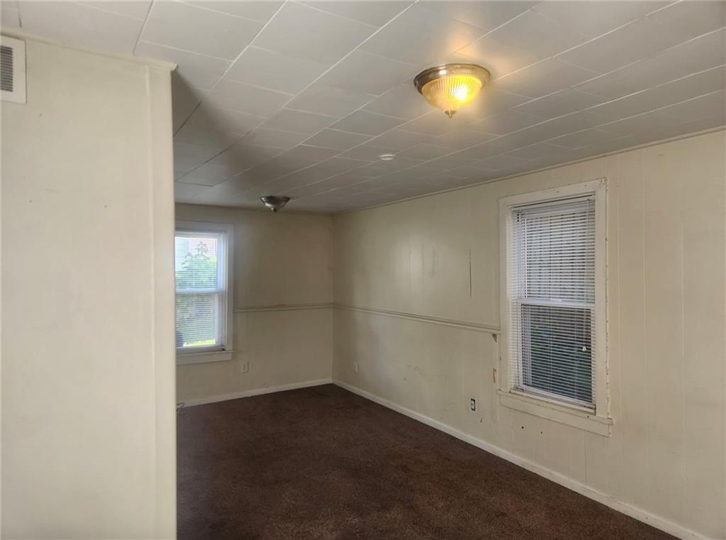 1726 Ridge Avenue Coraopolis, PA 15108 - Photo 8 of 41 an empty room with windows and entrance