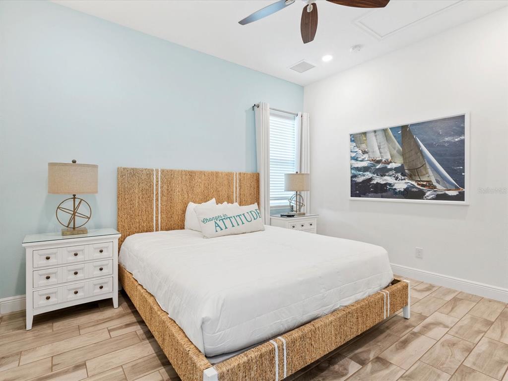 8092 Knee Deep Road Kissimmee, FL 34747 - Photo 11 of 26 a bedroom with a bed and painting on the wall