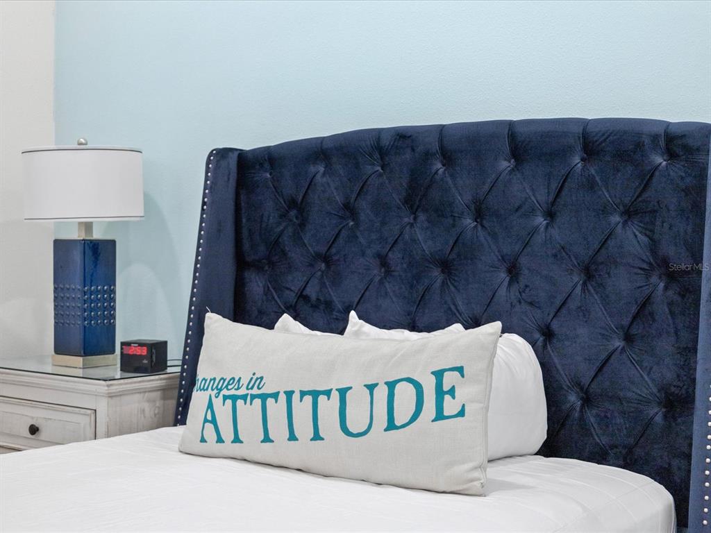 8092 Knee Deep Road Kissimmee, FL 34747 - Photo 16 of 26 a bedroom with a bed and a window