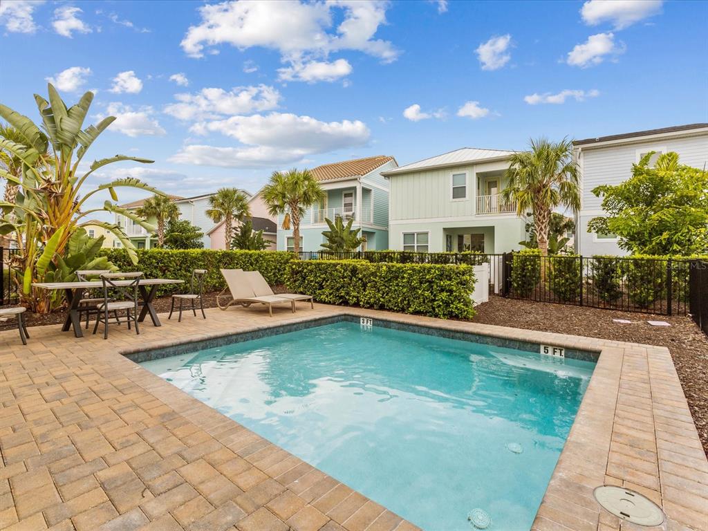 8092 Knee Deep Road Kissimmee, FL 34747 - Photo 2 of 26 a view of swimming pool with outdoor seating and a patio