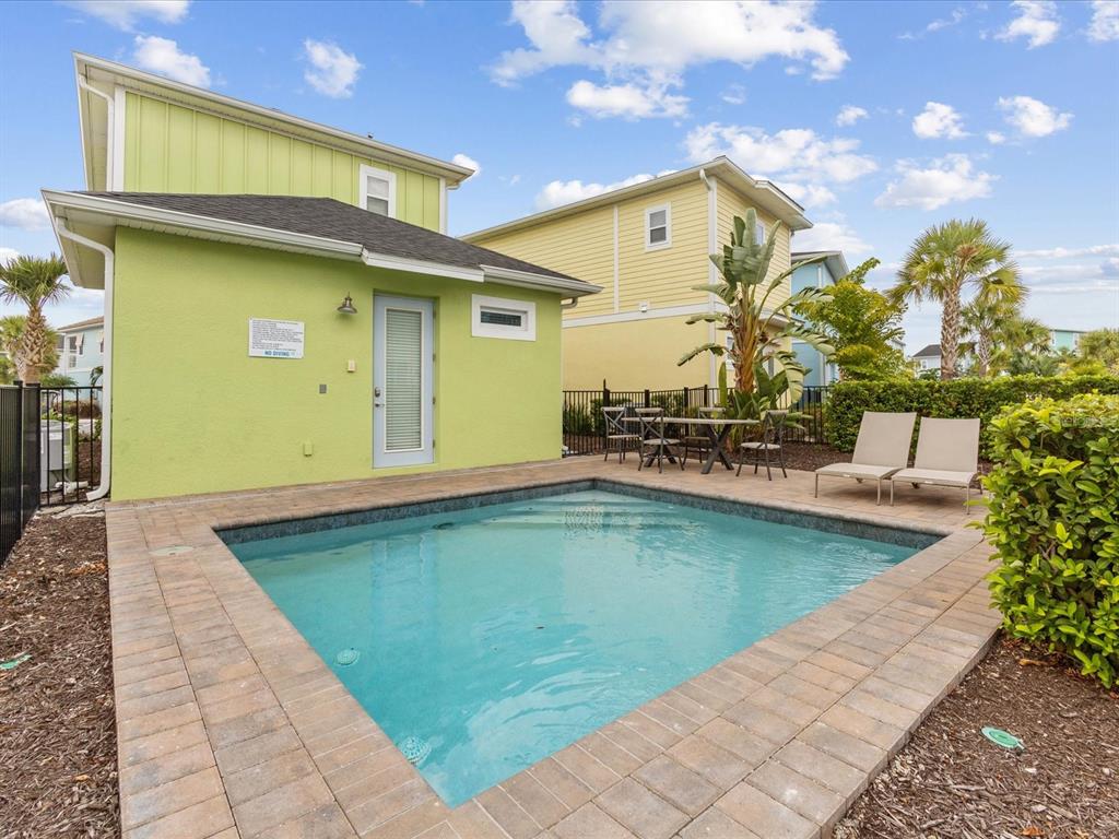 8092 Knee Deep Road Kissimmee, FL 34747 - Photo 22 of 26 a view of a swimming pool with an outdoor seating