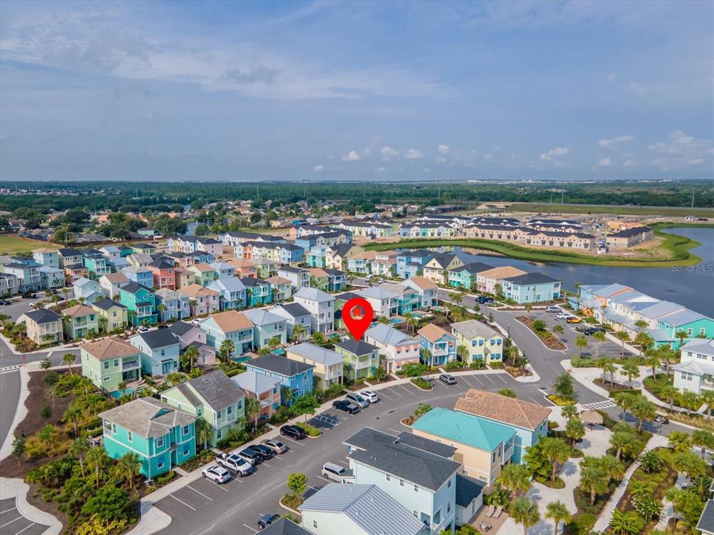 8092 Knee Deep Road Kissimmee, FL 34747 - Photo 25 of 26 an aerial view of a city with lots of residential buildings ocean and mountain view in back