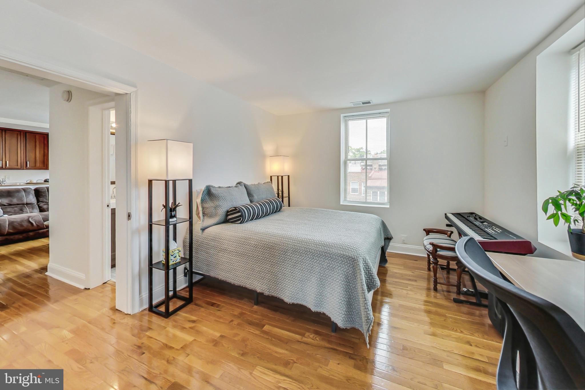 1451 Park Road Northwest, Unit 303 Washington, DC 20010 - Photo 13 of 27 a bed room with a bed and a window