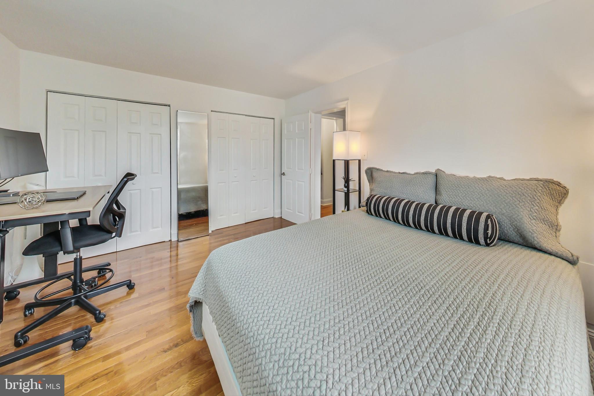 1451 Park Road Northwest, Unit 303 Washington, DC 20010 - Photo 15 of 27 a bedroom with a bed and a desk