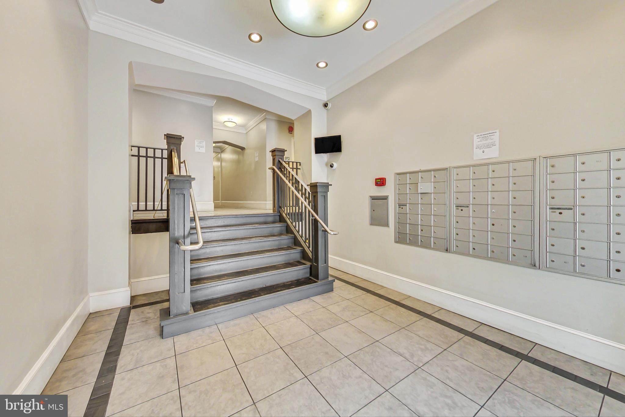 1451 Park Road Northwest, Unit 303 Washington, DC 20010 - Photo 3 of 27 a spacious bathroom with a bathtub and entryway