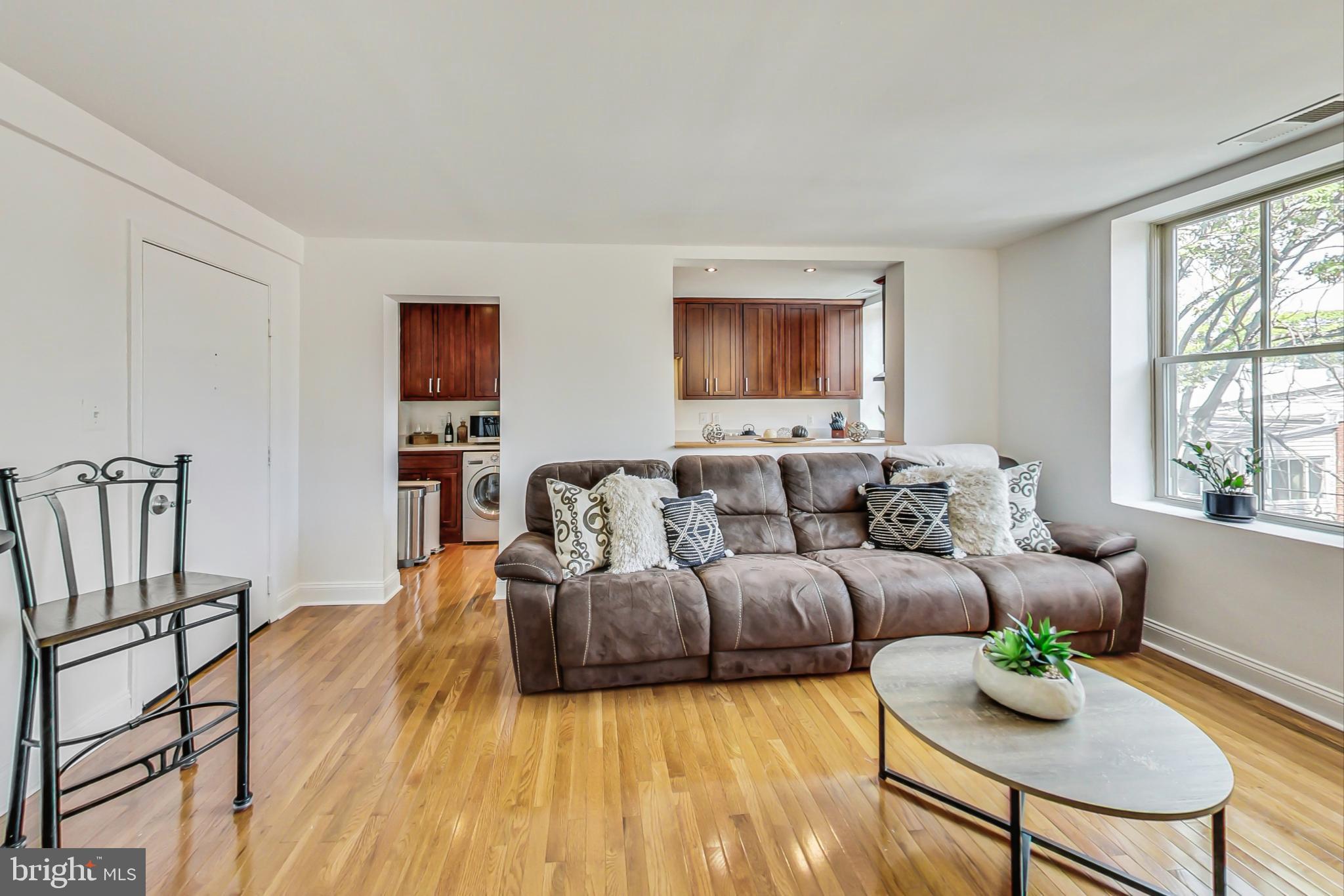1451 Park Road Northwest, Unit 303 Washington, DC 20010 - Photo 7 of 27 a living room with furniture and a window