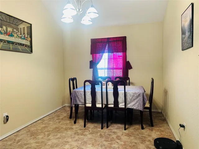 a view of a dining room with furniture