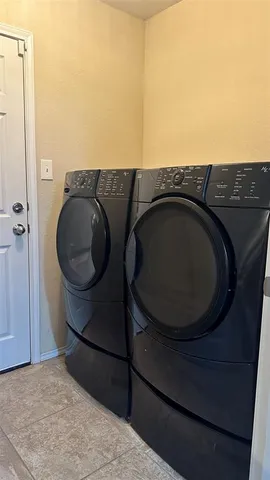 a bedroom with a bed and a mirror