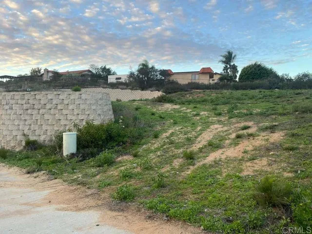 a view of a lake with a yard